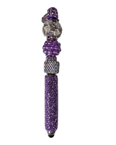 Decorative purple pen with gemstone accents on a white background