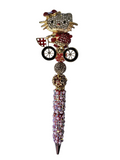 Main Character on the Move | Crystal Hello Kitty, Red Pearl & Gold Luxe Pen